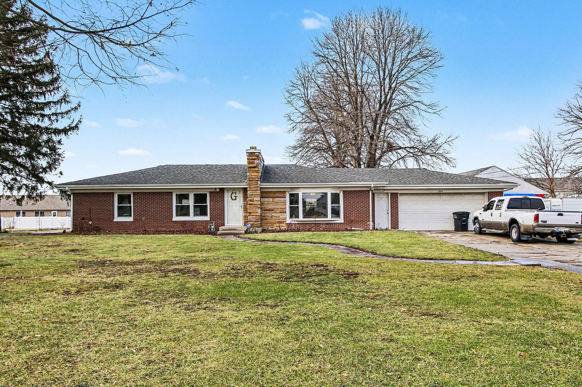 2954 Airport Road Portage, IN 46368 - Photo 11 of 14 a front view of a house with a garden