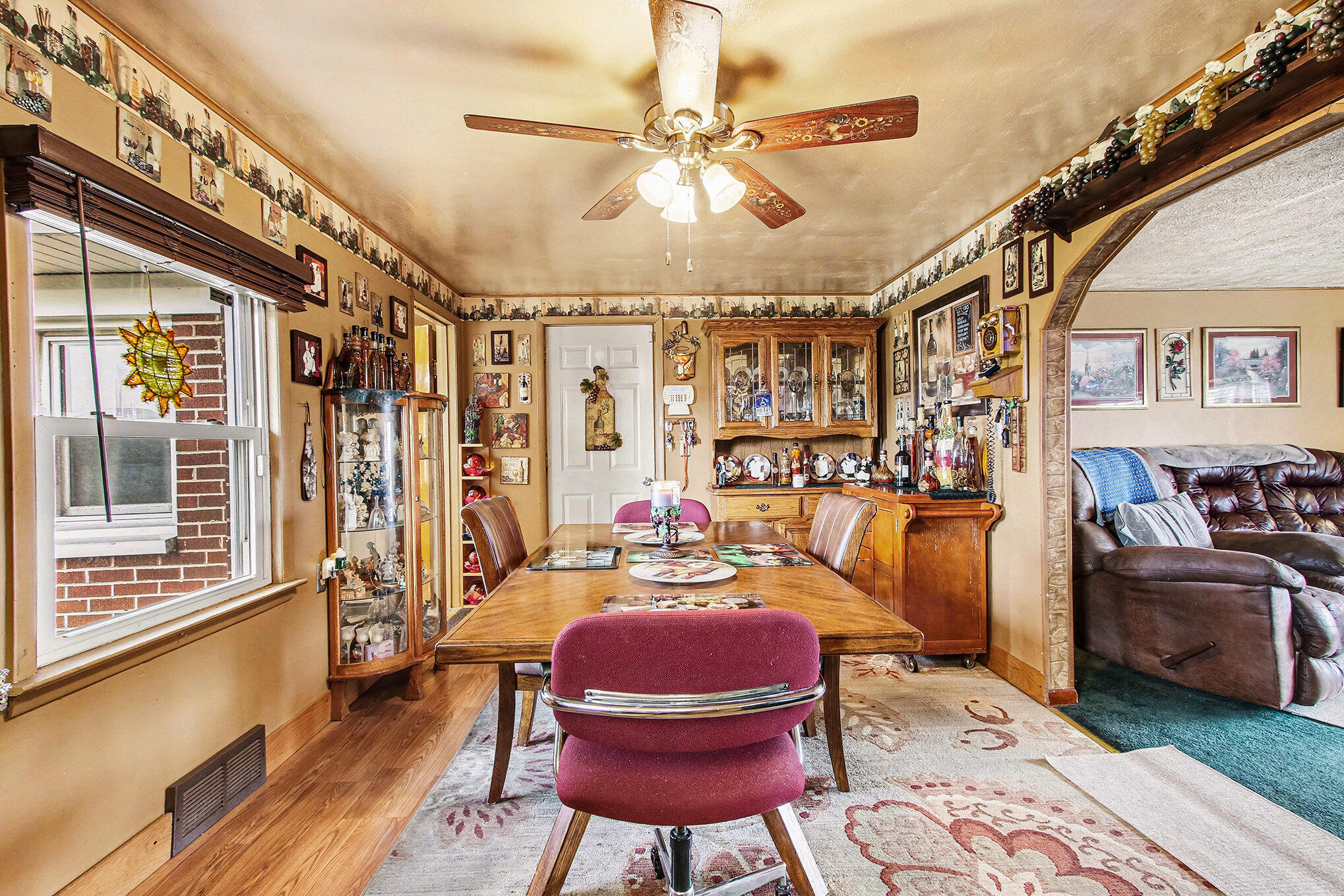 2954 Airport Road Portage, IN 46368 - Photo 3 of 14 a view of a livingroom with furniture a ceiling fan and window