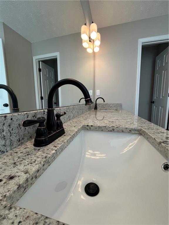 2147 St Albans Place Buford, GA 30519 - Photo 21 of 29 a bathroom with a sink