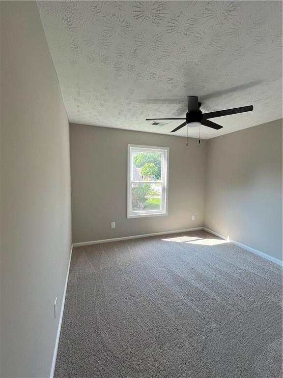 2147 St Albans Place Buford, GA 30519 - Photo 26 of 29 a view of an empty room with a window