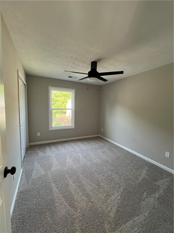 2147 St Albans Place Buford, GA 30519 - Photo 28 of 29 an empty room with windows and entrance