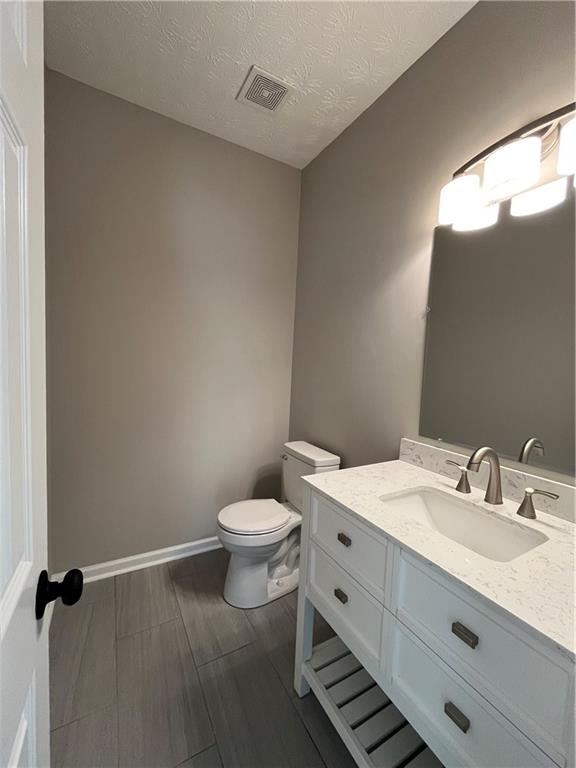 2147 St Albans Place Buford, GA 30519 - Photo 7 of 29 a bathroom with a sink and a toilet