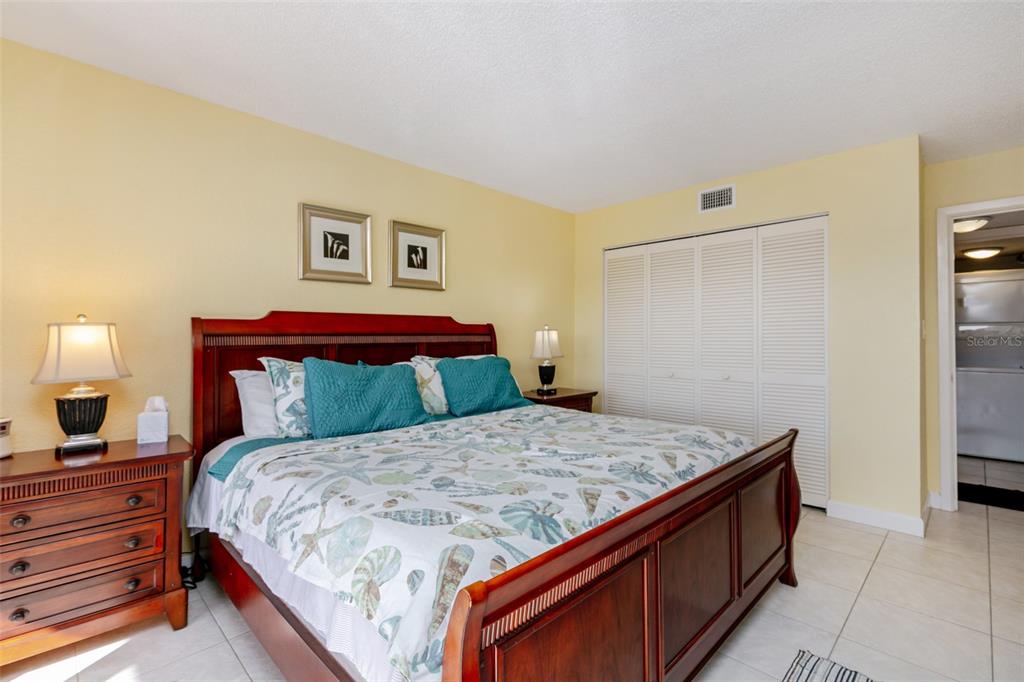 3170 Matecumbe Road, Unit 127 Punta Gorda, FL 33955 - Photo 8 of 20 a bedroom with a bed and a night stand