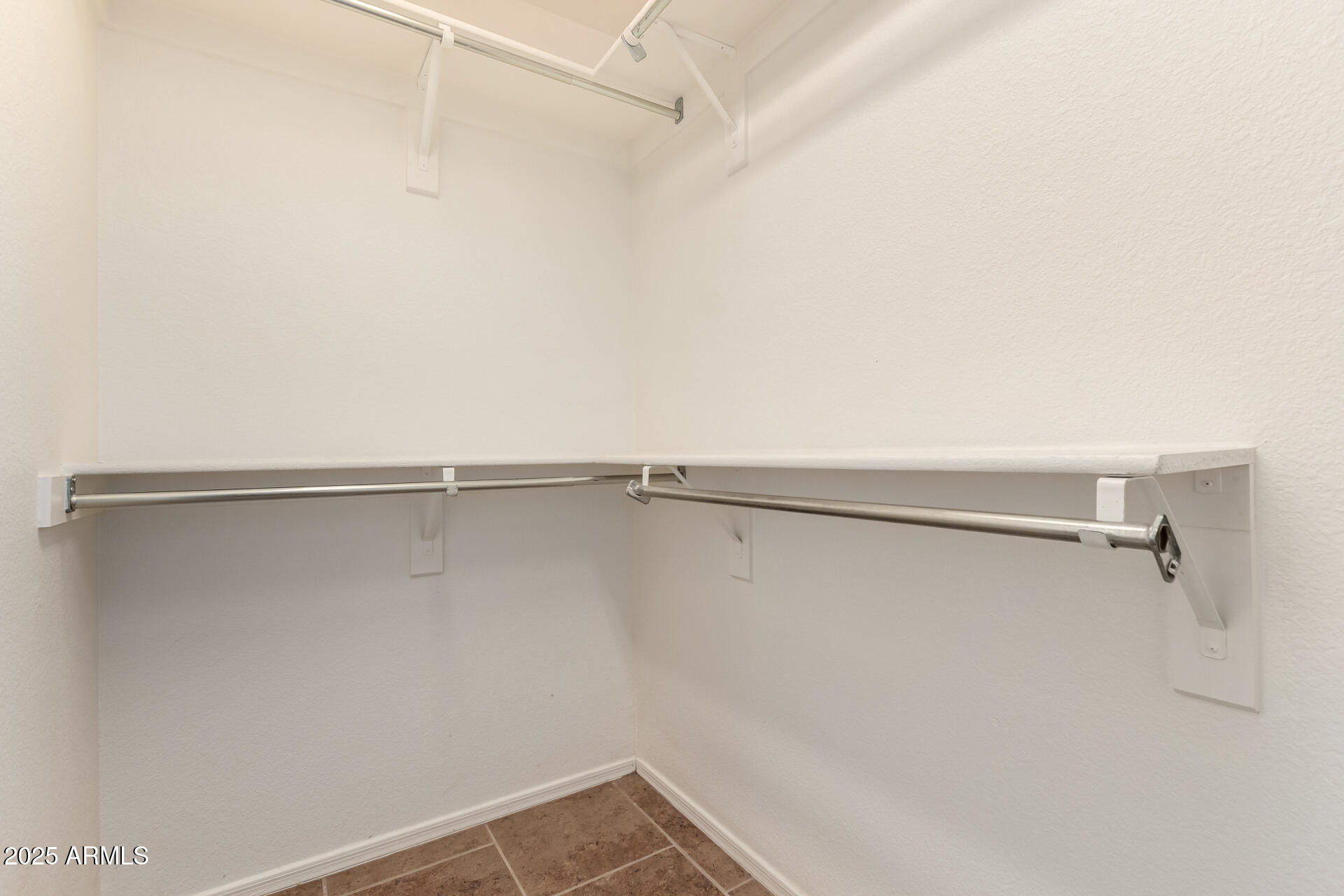 1475 East Riviera Drive Chandler, AZ 85249 - Photo 12 of 22 a view of a room with racks on the wall