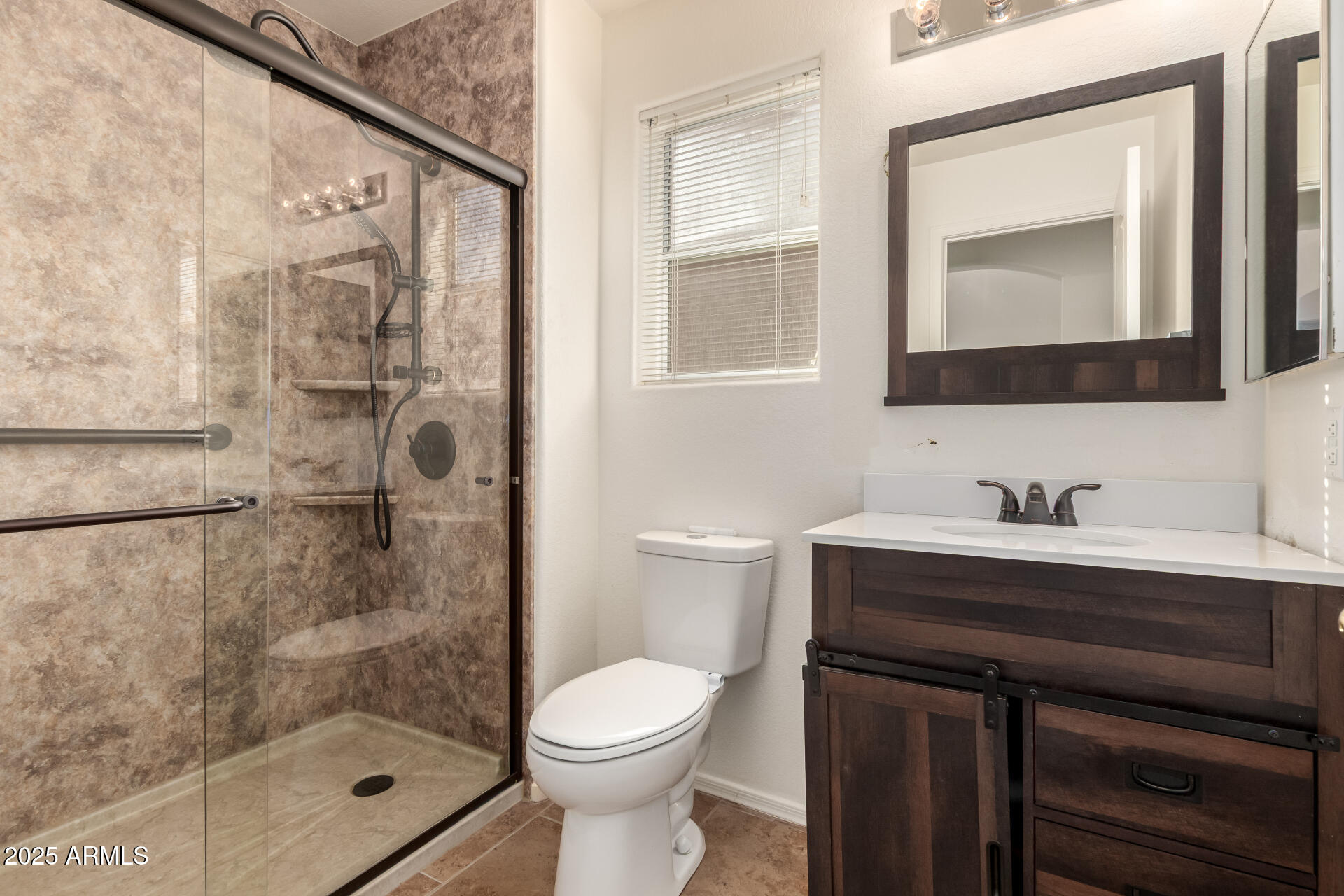 1475 East Riviera Drive Chandler, AZ 85249 - Photo 15 of 22 a bathroom with a sink a toilet and shower