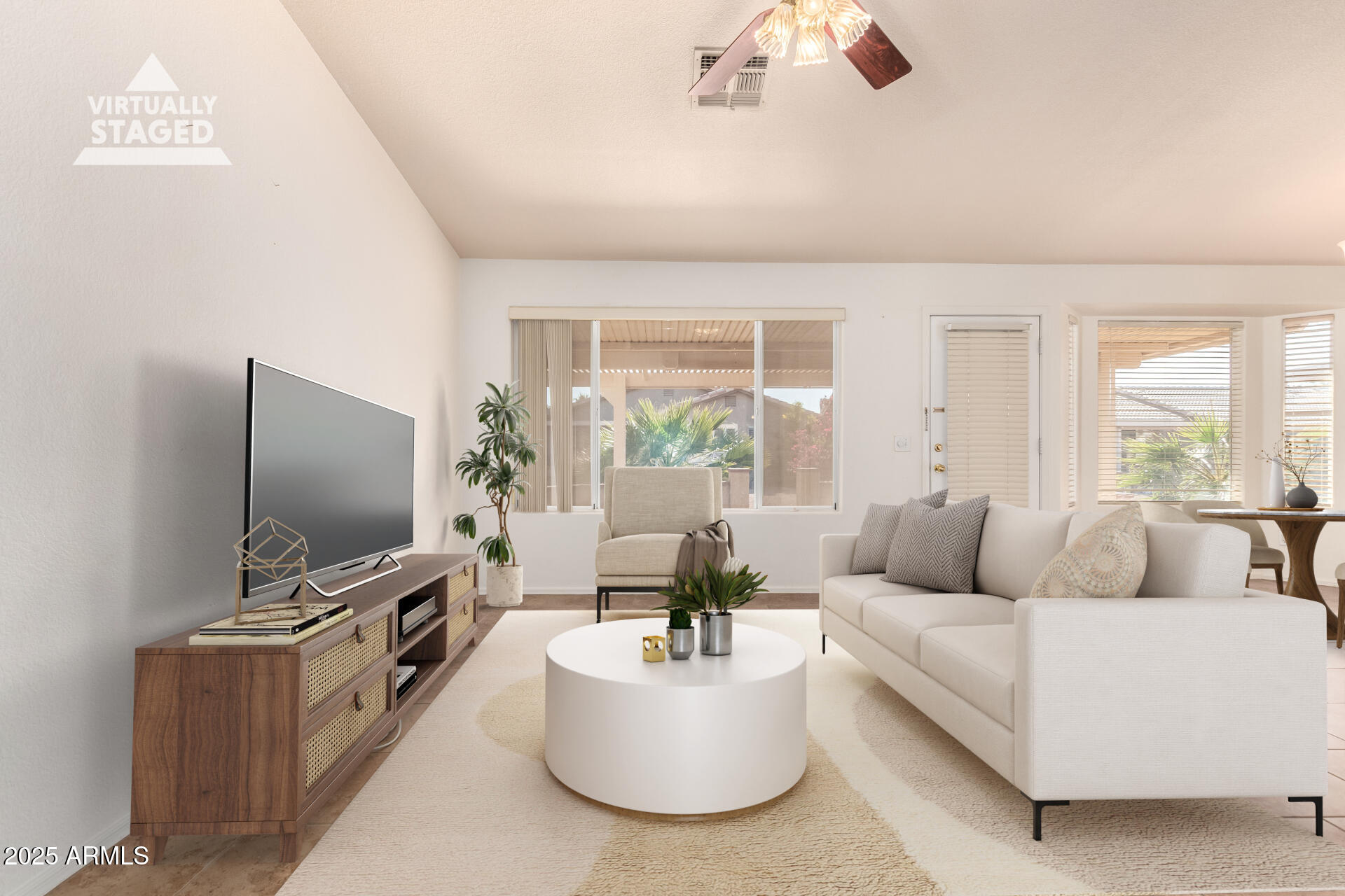 1475 East Riviera Drive Chandler, AZ 85249 - Photo 5 of 22 a living room with furniture and a flat screen tv