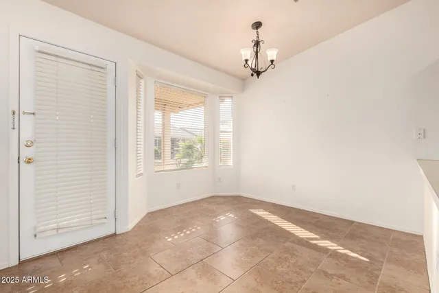 a view of empty room with windows