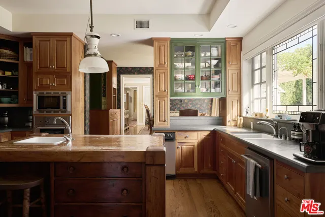 a kitchen with a sink stove and refrigerator