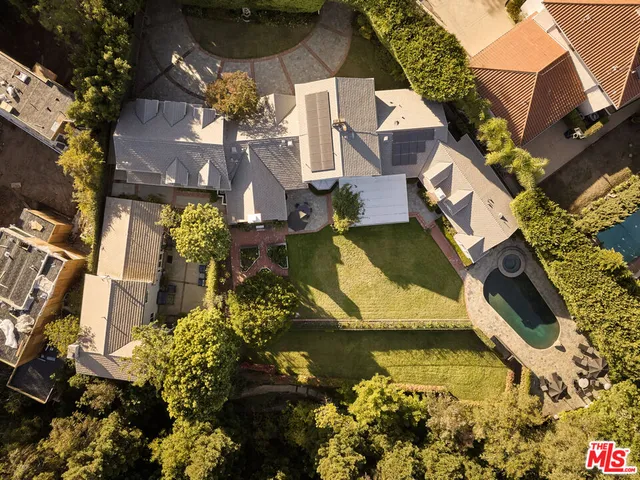 an aerial view of a house with a lake view