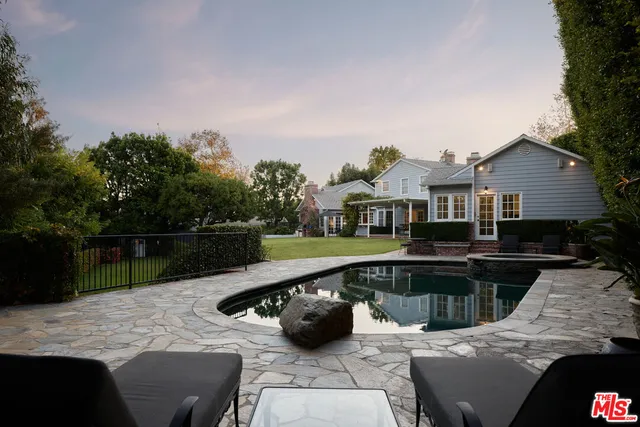 a view of swimming pool with seating space