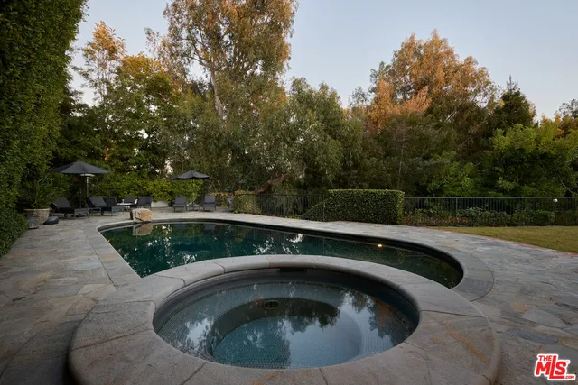 a view of swimming pool from a outdoor seating