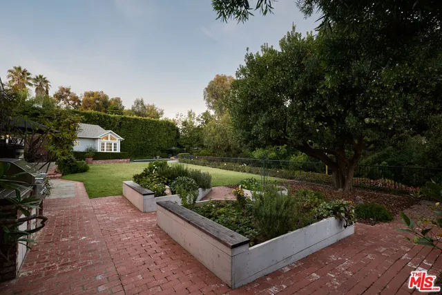 a view of a garden with patio