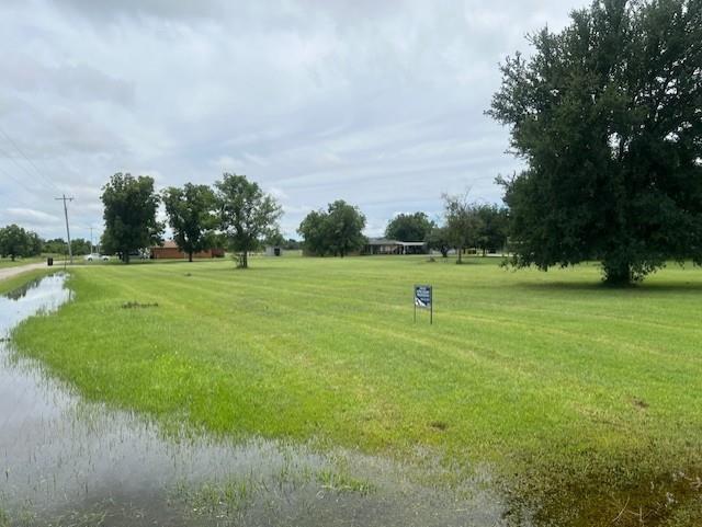 950 Harris Street Mingus, TX 76463 - Photo 2 of 4 View of home's community featuring a lawn