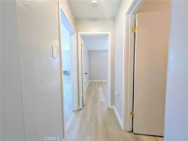a view of a bathroom from a hallway