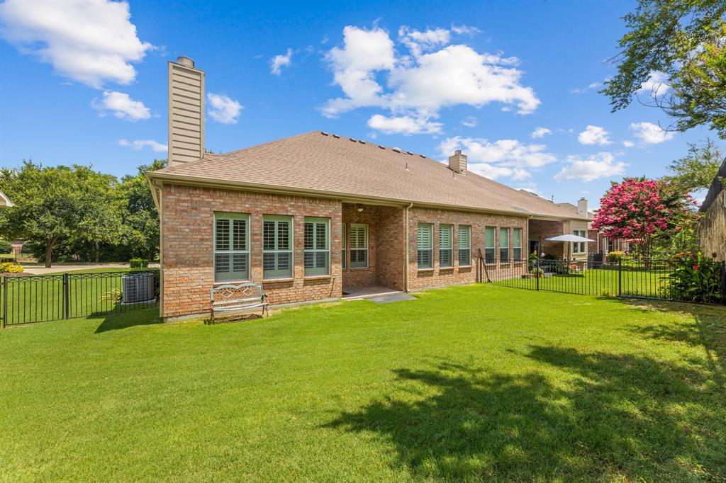 719 Scenic Ranch Circle Fairview, TX 75069 - Photo 19 of 36 a front view of house with yard and green space