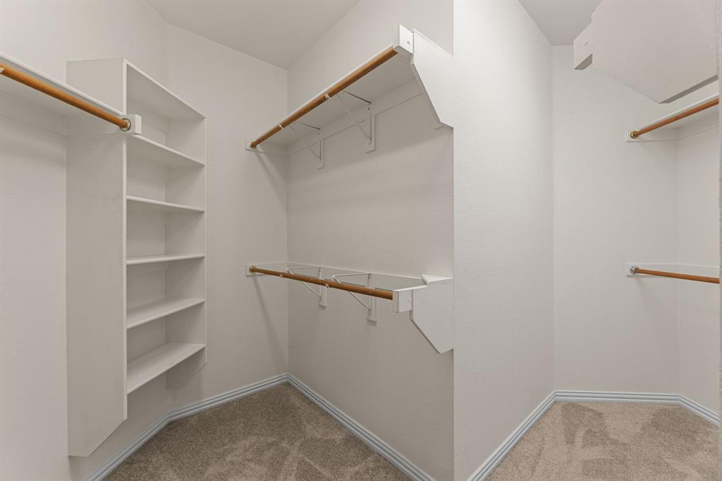 719 Scenic Ranch Circle Fairview, TX 75069 - Photo 25 of 36 a view of a room with rack on the wall