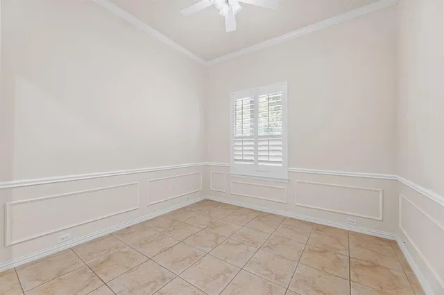 a bedroom with a bed a lamp and a window