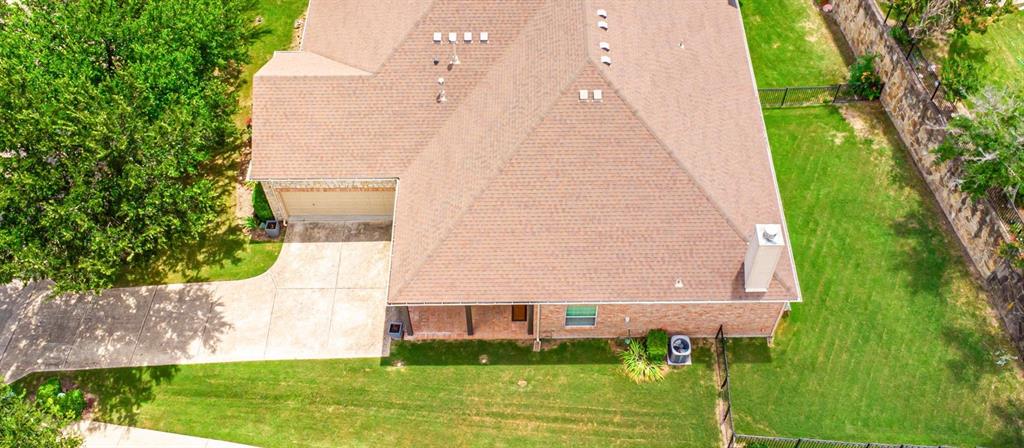 719 Scenic Ranch Circle Fairview, TX 75069 - Photo 34 of 36 a view of a large building with a yard