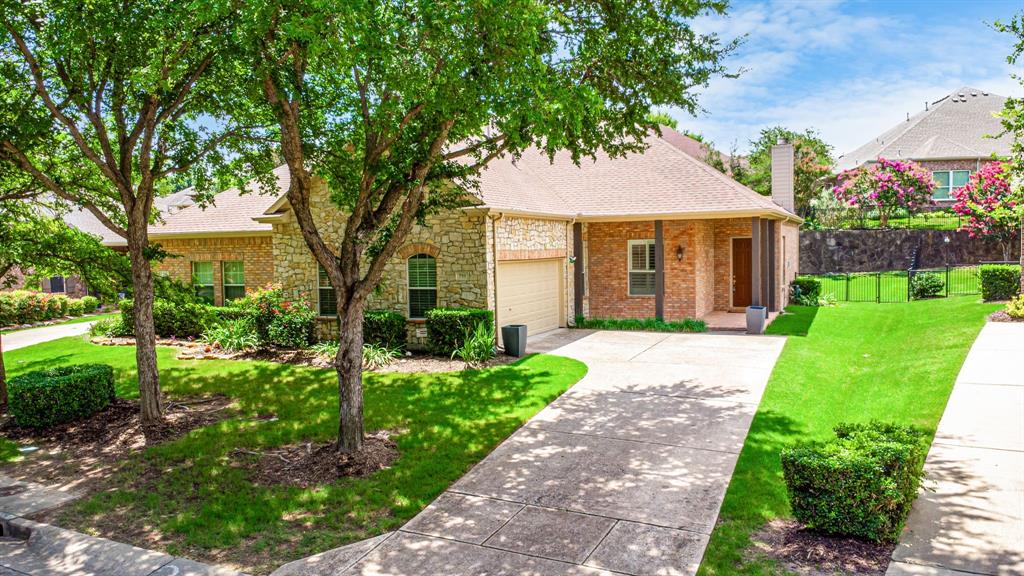 719 Scenic Ranch Circle Fairview, TX 75069 - Photo 35 of 36 a front view of a house with a yard and potted plants