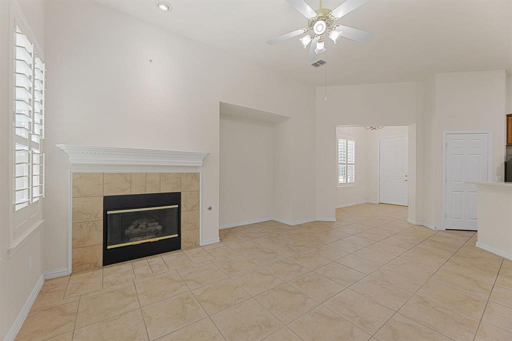 719 Scenic Ranch Circle Fairview, TX 75069 - Photo 6 of 36 a view of empty room with fireplace and fan