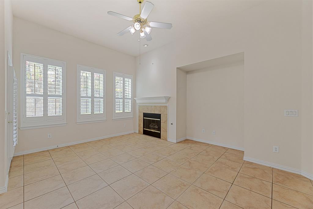 719 Scenic Ranch Circle Fairview, TX 75069 - Photo 8 of 36 a view of an empty room with a fireplace and a window