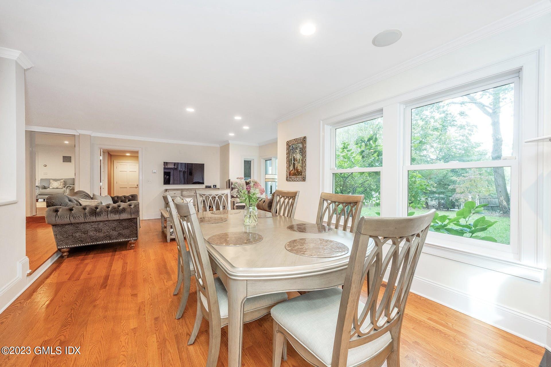 52 Hendrie Avenue Riverside, CT 06878 - Photo 11 of 30 a view of a dining room with furniture and wooden floor