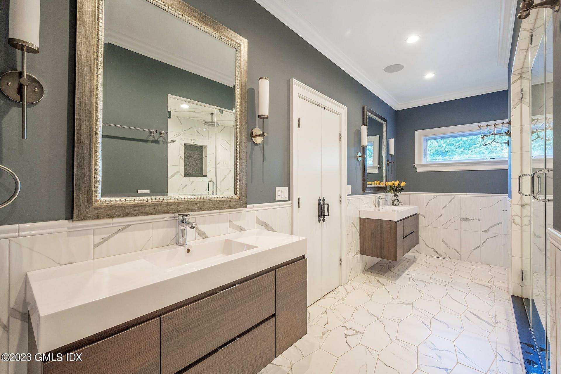 52 Hendrie Avenue Riverside, CT 06878 - Photo 16 of 30 a bathroom with a sink double vanity and a mirror