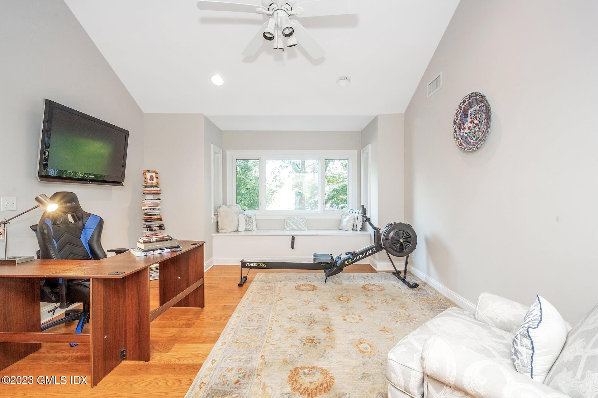 52 Hendrie Avenue Riverside, CT 06878 - Photo 17 of 30 a living room with furniture and a flat screen tv
