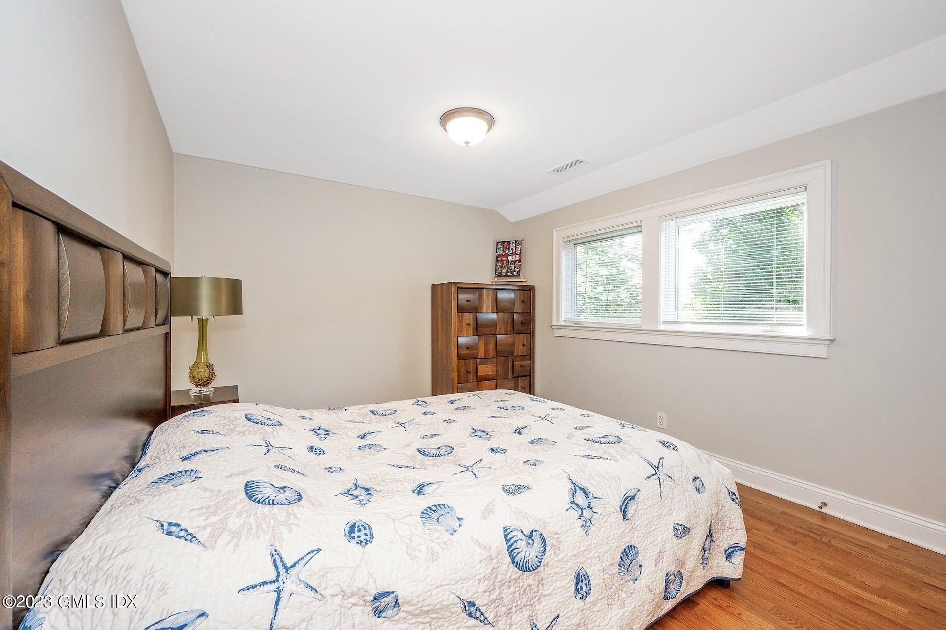 52 Hendrie Avenue Riverside, CT 06878 - Photo 18 of 30 a bedroom with a large bed and a window