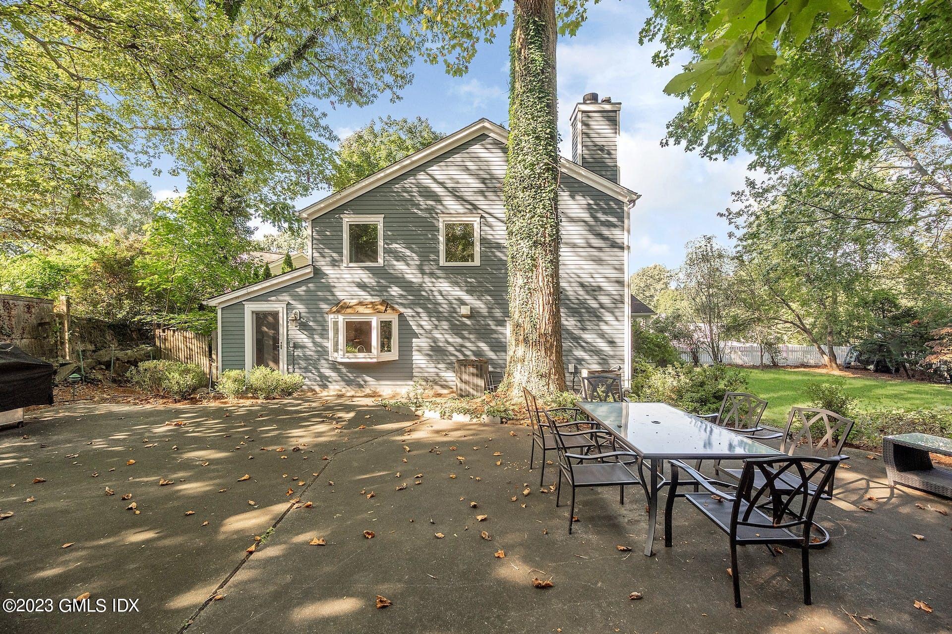 52 Hendrie Avenue Riverside, CT 06878 - Photo 27 of 30 a view of a outdoor space with a table and chairs