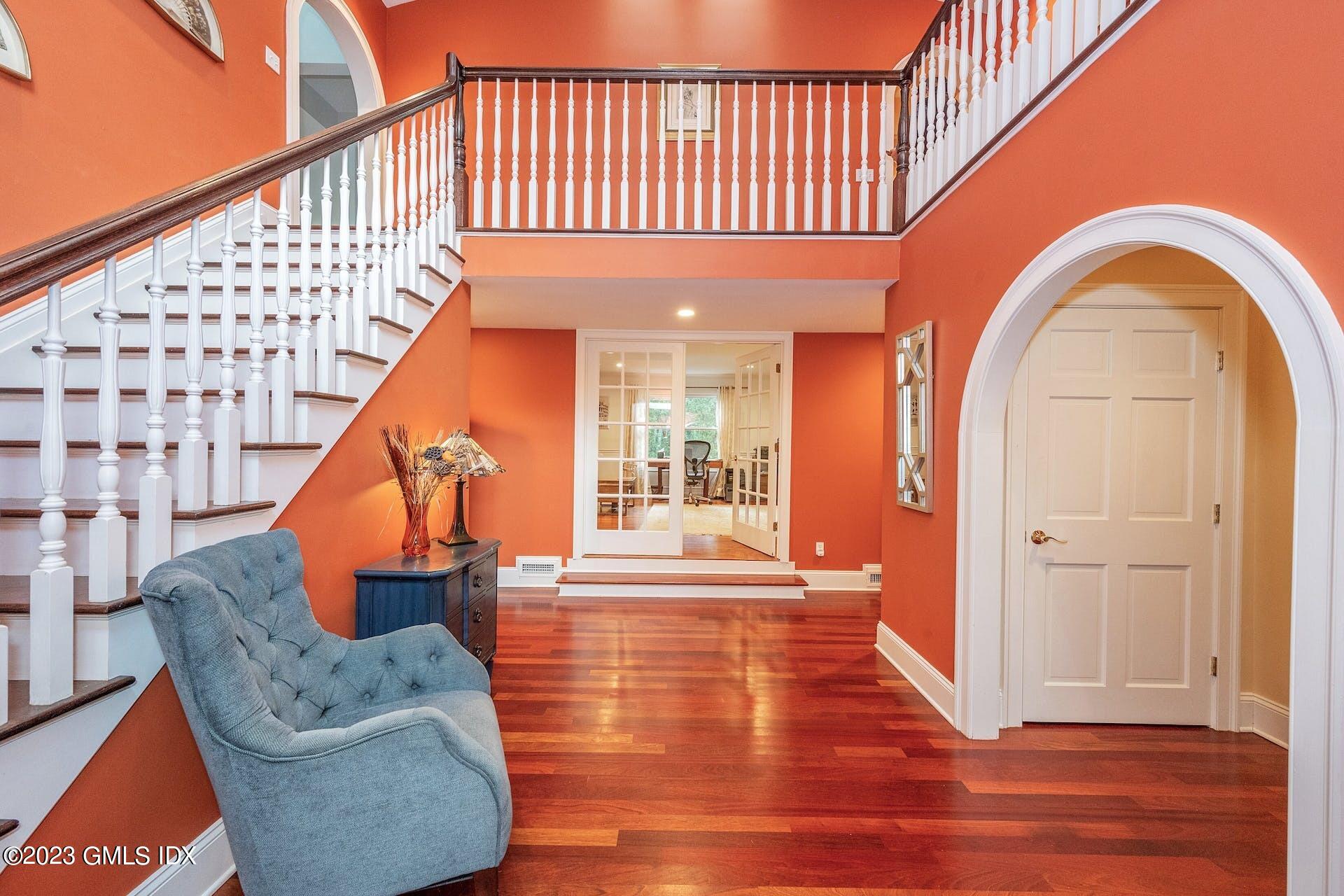 52 Hendrie Avenue Riverside, CT 06878 - Photo 3 of 30 a view of entryway with wooden floor and stairs