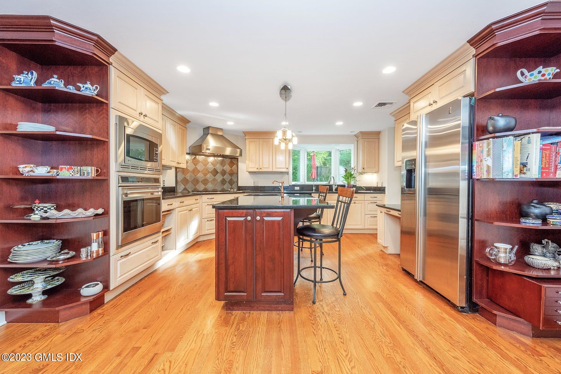 52 Hendrie Avenue Riverside, CT 06878 - Photo 6 of 30 a living room with stainless steel appliances furniture a rug and a kitchen view
