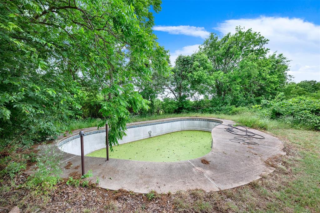 1415 South Joe Wilson Road Cedar Hill, TX 75104 - Photo 3 of 17 a view of a backyard with swimming pool