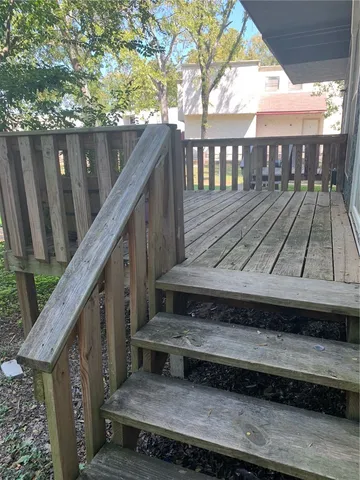 a view of a wooden deck with a bench