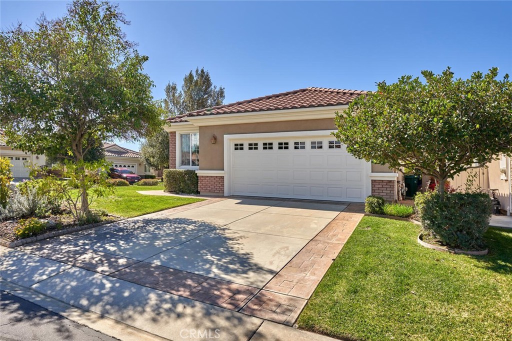 1143 Saguara Road Beaumont, CA 92223 - Photo 9 of 66 a front view of a house with a yard