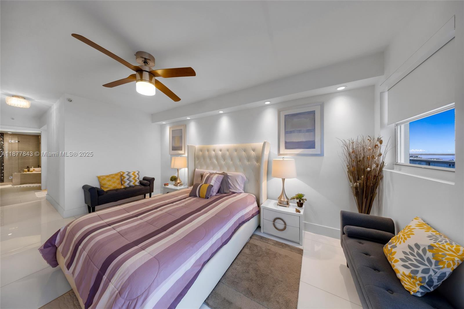 6301 Collins Avenue, Unit 2107 Miami Beach, FL 33141 - Photo 17 of 42 a bedroom with bed and a window