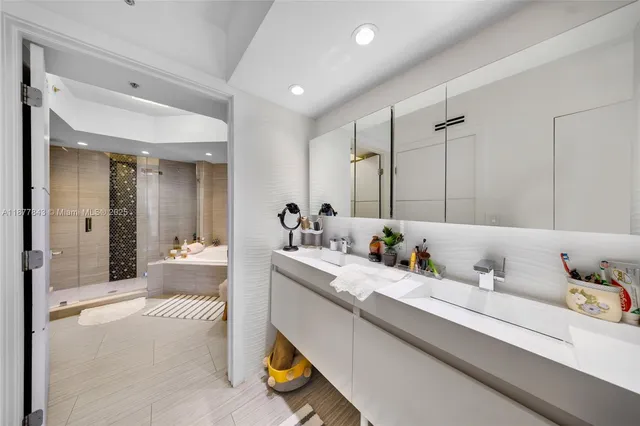 a view of bathroom with dual sinks