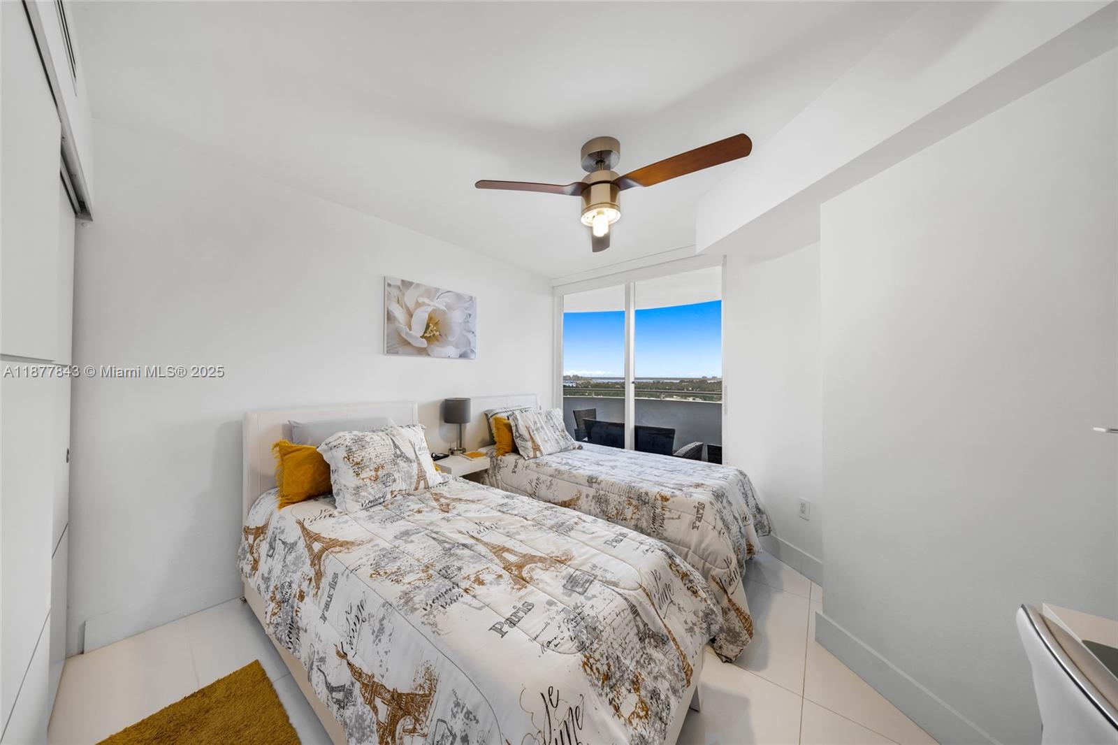 6301 Collins Avenue, Unit 2107 Miami Beach, FL 33141 - Photo 20 of 42 a bedroom with a bed and a window