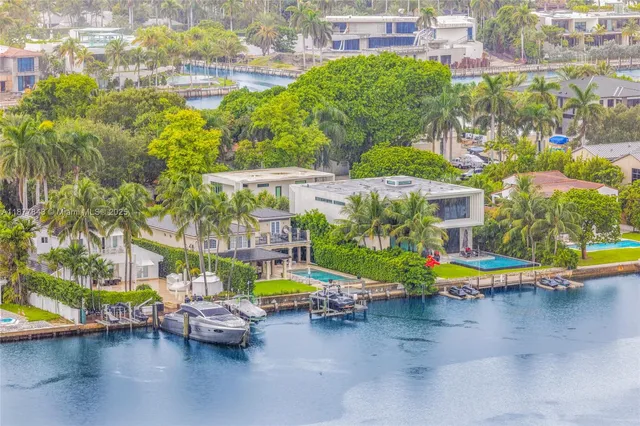 a view of a swimming pool with a patio and a garden