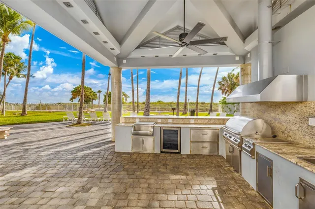 a kitchen with stainless steel appliances granite countertop a stove and a sink