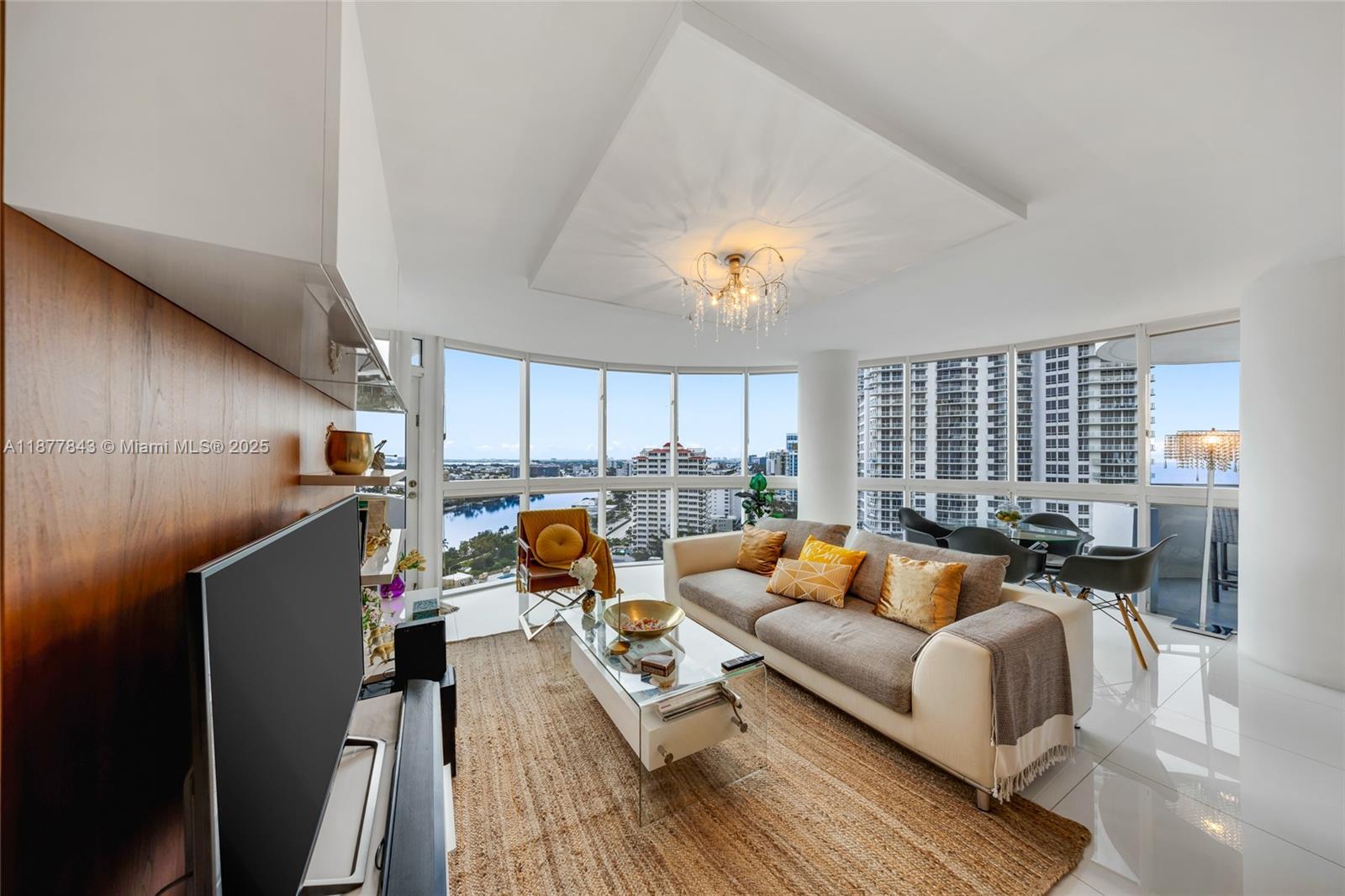 6301 Collins Avenue, Unit 2107 Miami Beach, FL 33141 - Photo 6 of 42 a living room with furniture and a large window