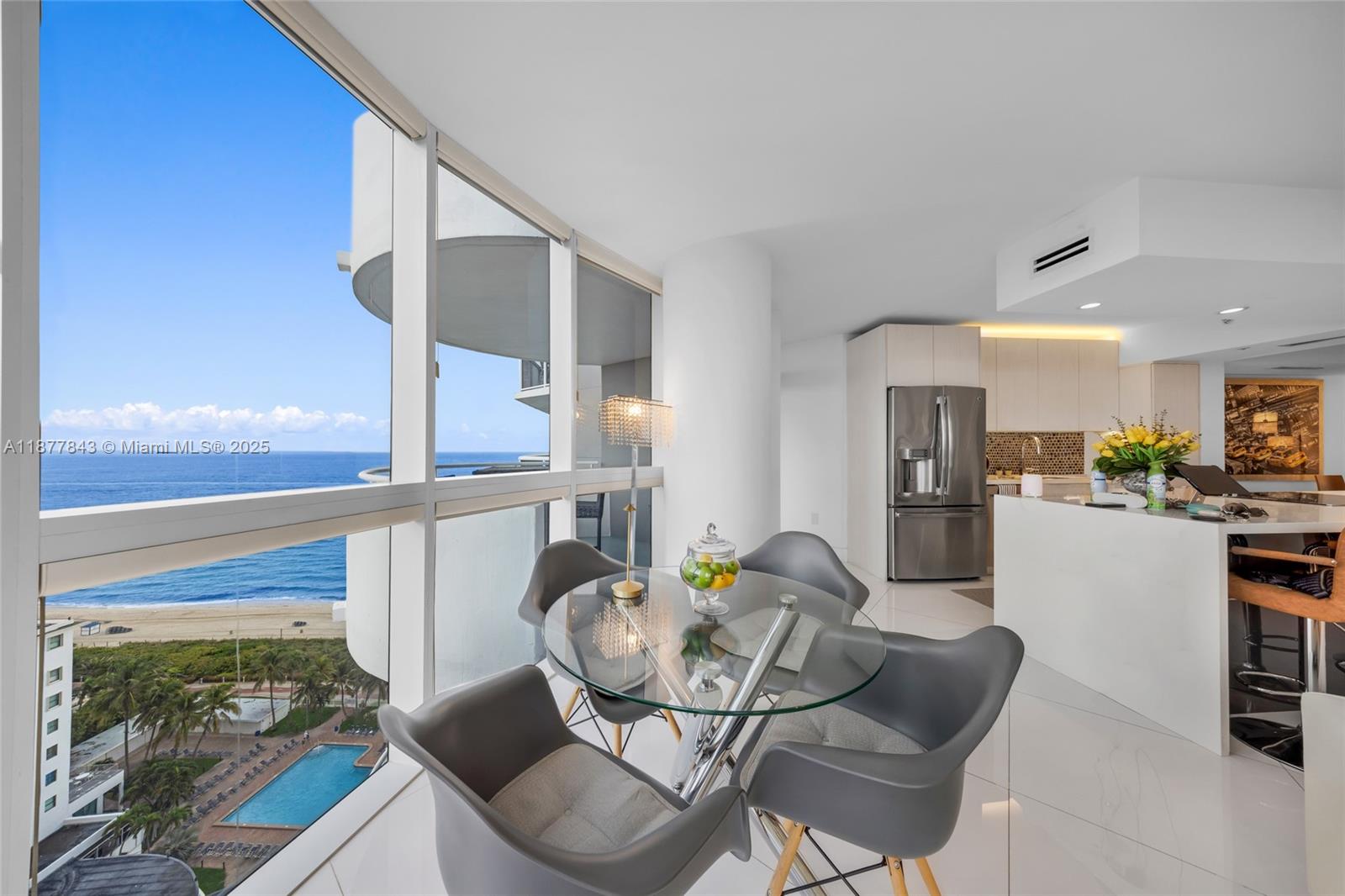6301 Collins Avenue, Unit 2107 Miami Beach, FL 33141 - Photo 7 of 42 a living room with furniture and a large window