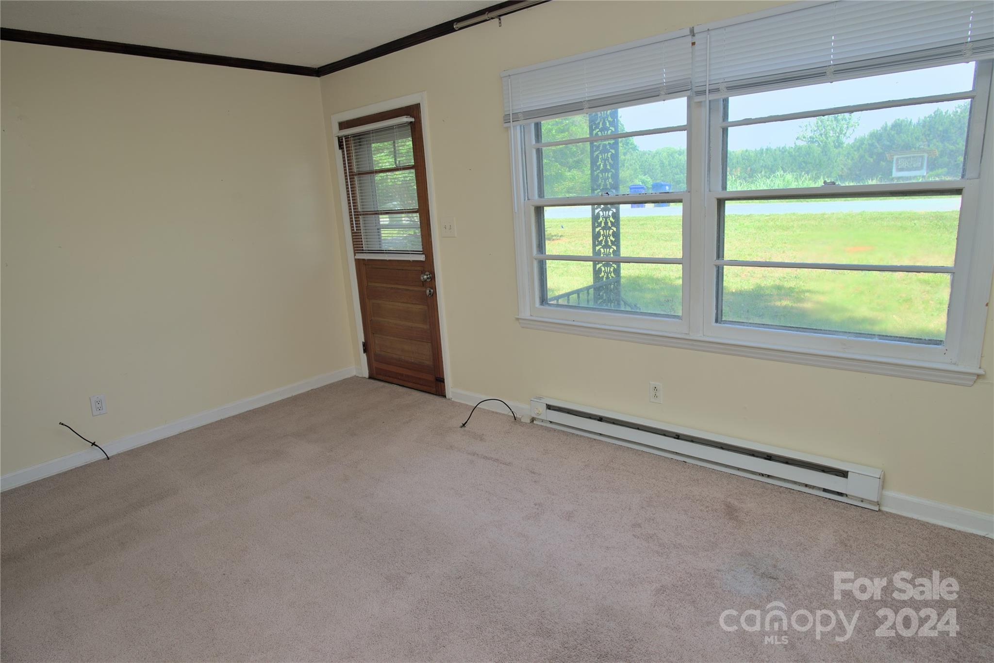 14903 Beatties Ford Road Huntersville, NC 28078 - Photo 15 of 25 an empty room with a window