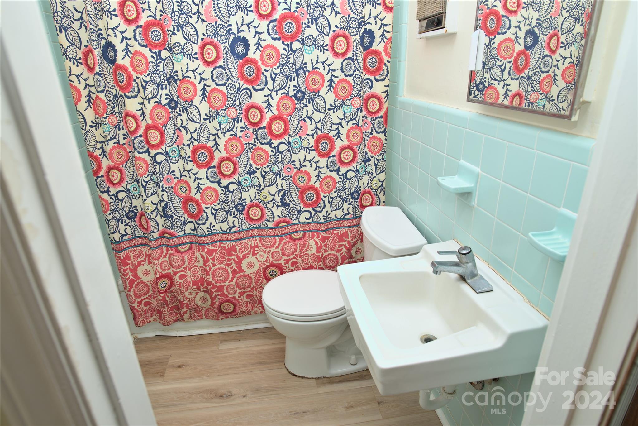 14903 Beatties Ford Road Huntersville, NC 28078 - Photo 17 of 25 a bathroom with a toilet and a sink