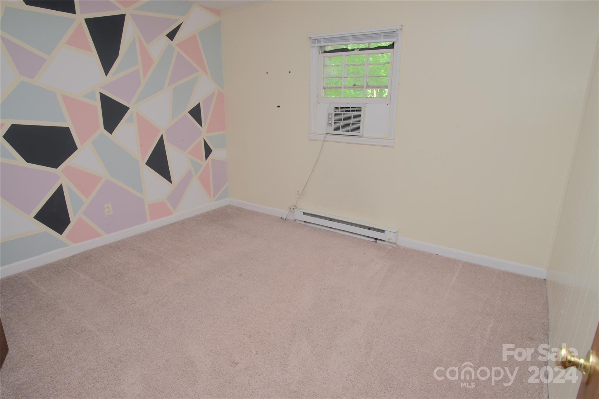 14903 Beatties Ford Road Huntersville, NC 28078 - Photo 19 of 25 an empty room with a windows and ceiling fan