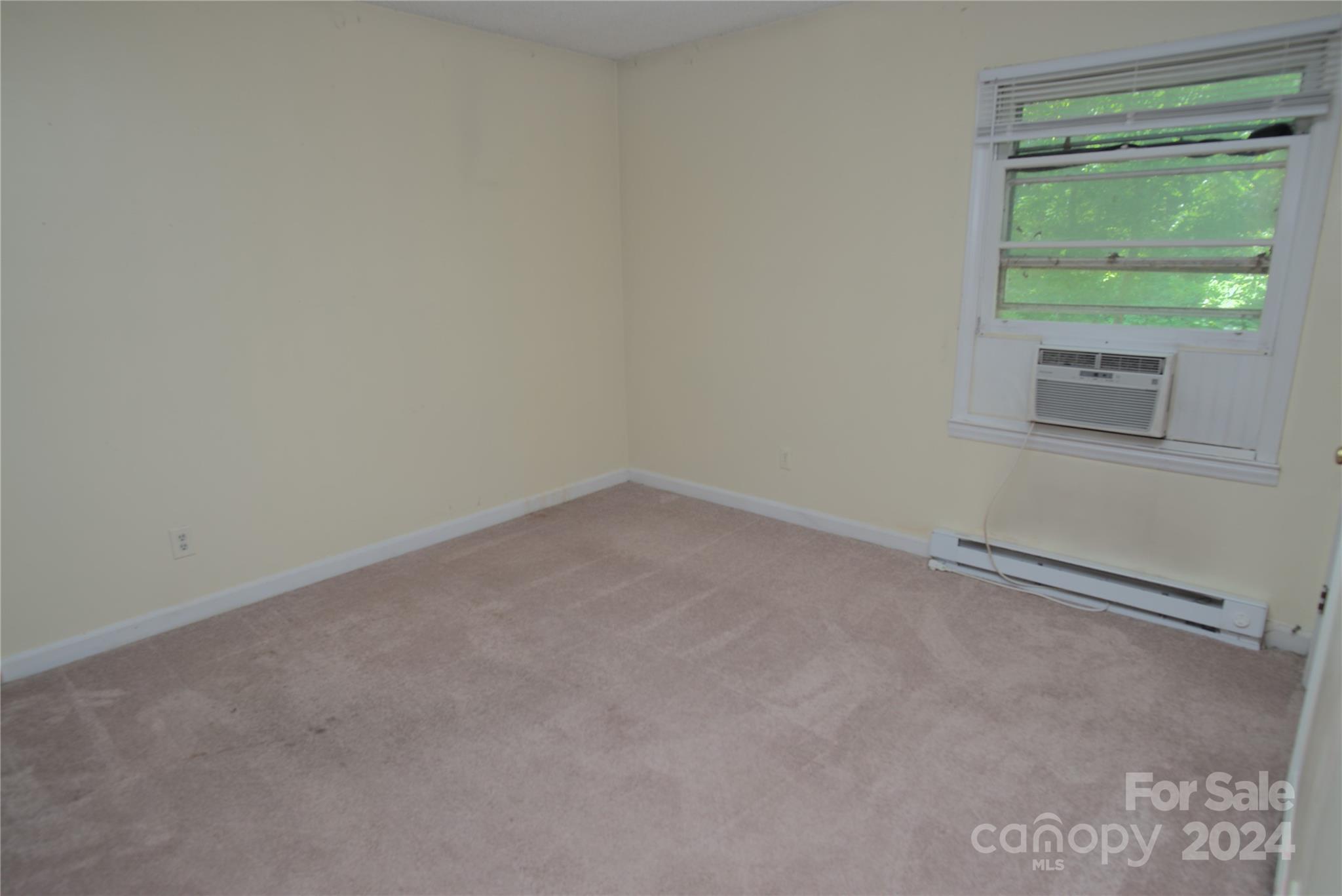 14903 Beatties Ford Road Huntersville, NC 28078 - Photo 21 of 25 a view of an empty room with a window