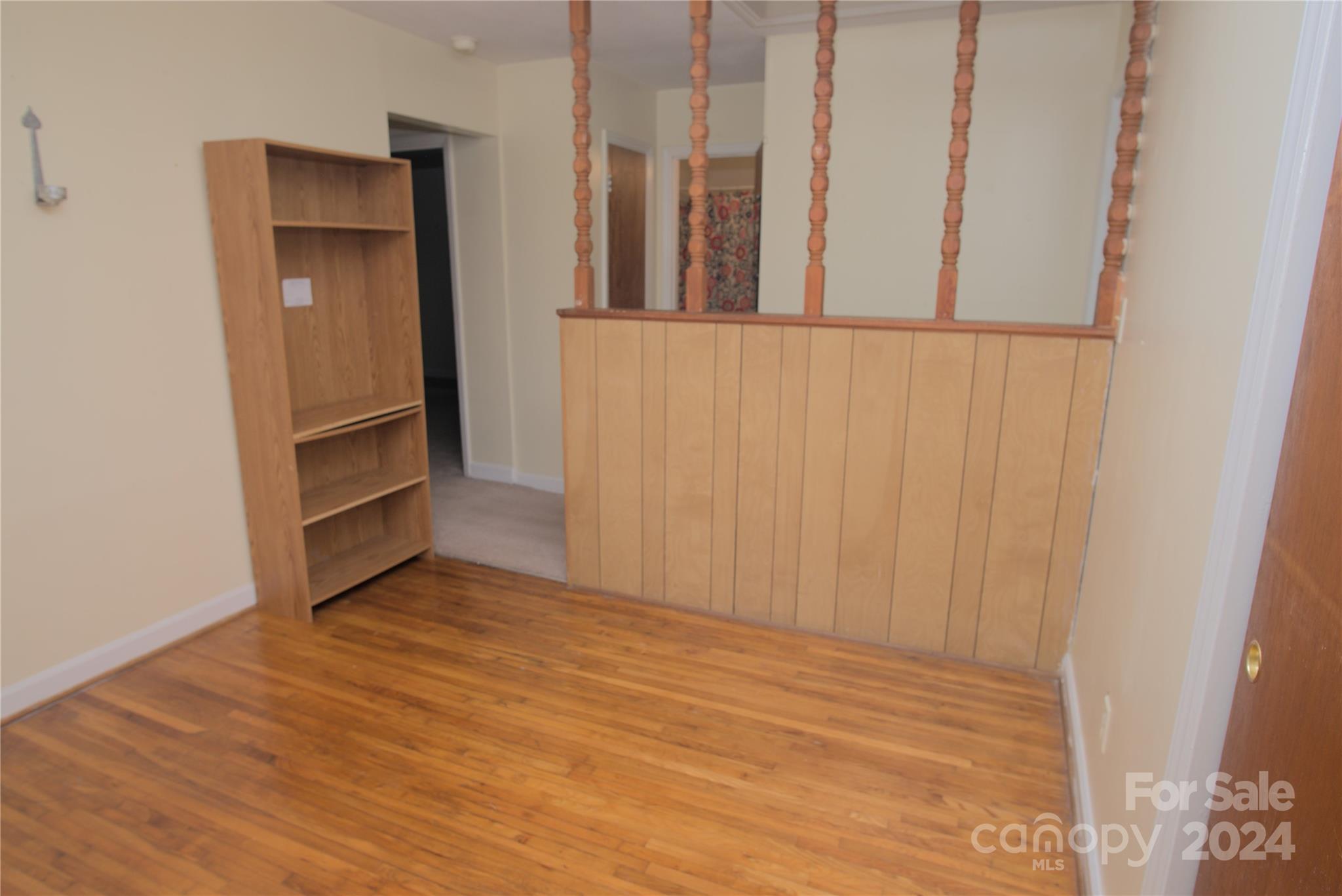 14903 Beatties Ford Road Huntersville, NC 28078 - Photo 22 of 25 a view of an empty room with wooden floor and a window