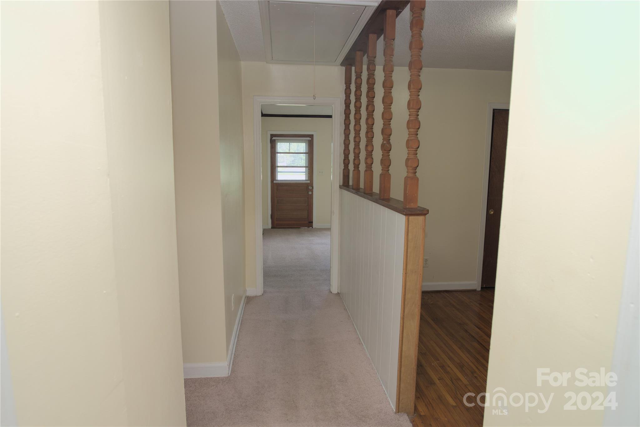 14903 Beatties Ford Road Huntersville, NC 28078 - Photo 23 of 25 a view of a hallway with wooden floor and entryway
