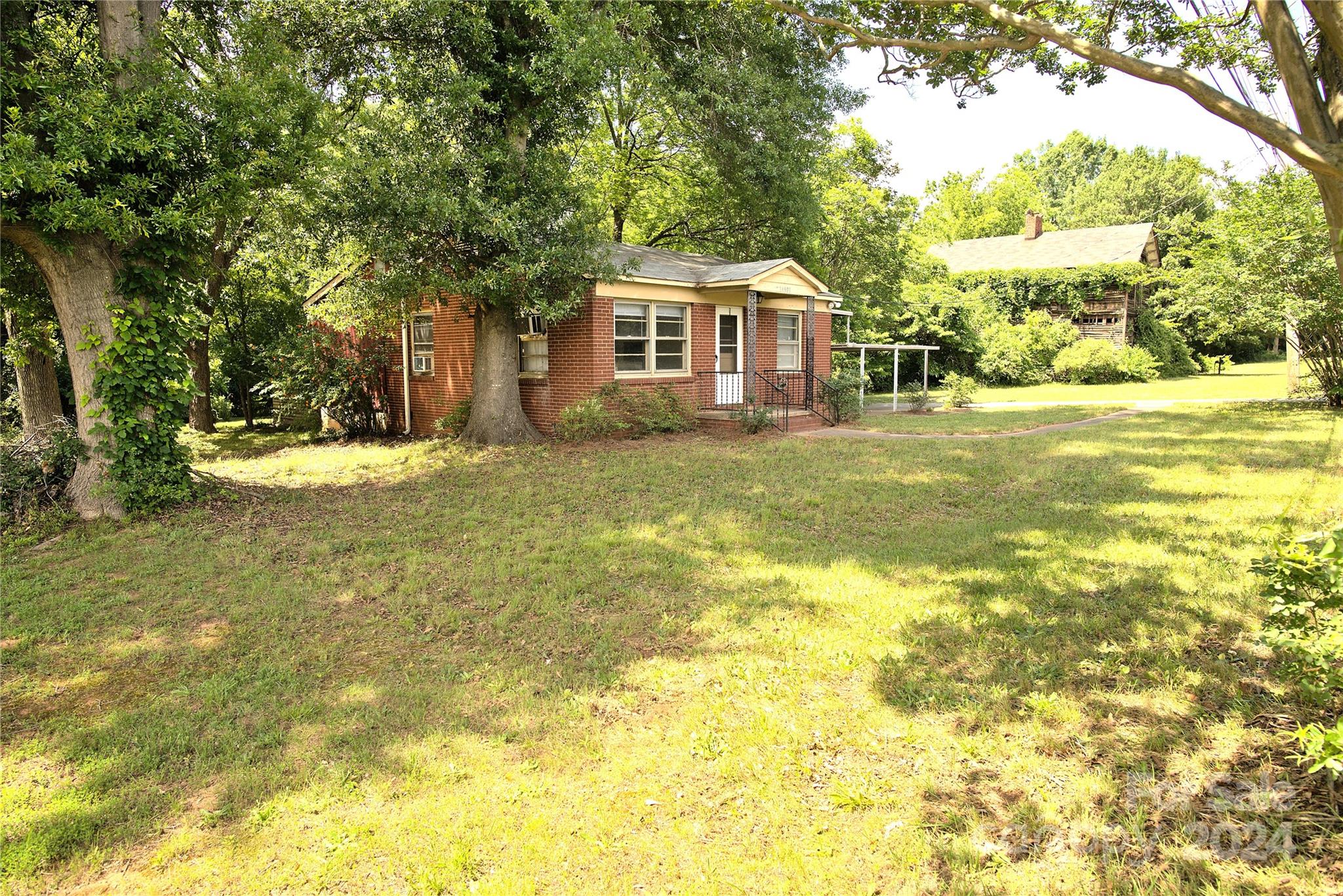 14903 Beatties Ford Road Huntersville, NC 28078 - Photo 3 of 25 a front view of a house with a yard