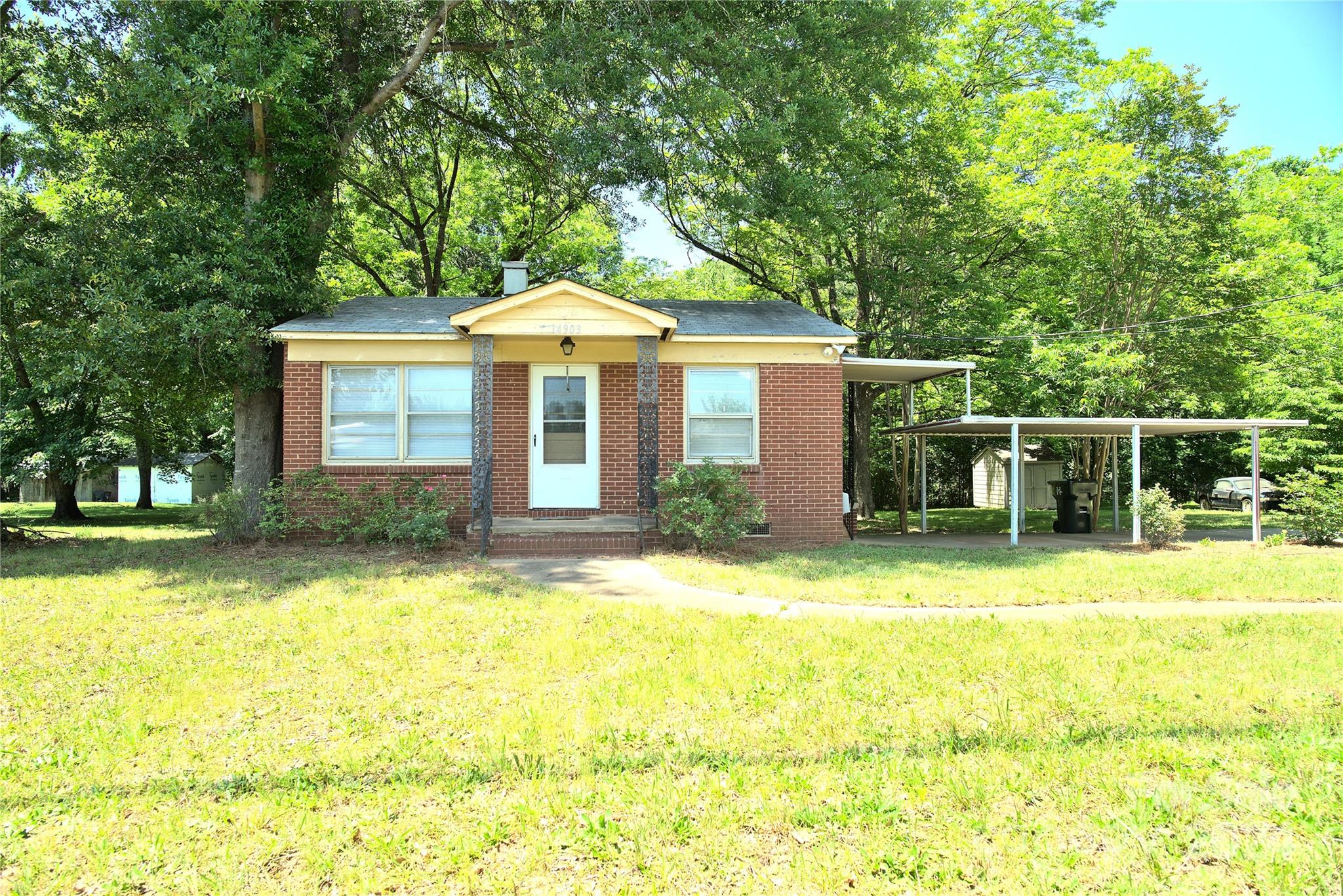 14903 Beatties Ford Road Huntersville, NC 28078 - Photo 5 of 25 a front view of a house with a yard